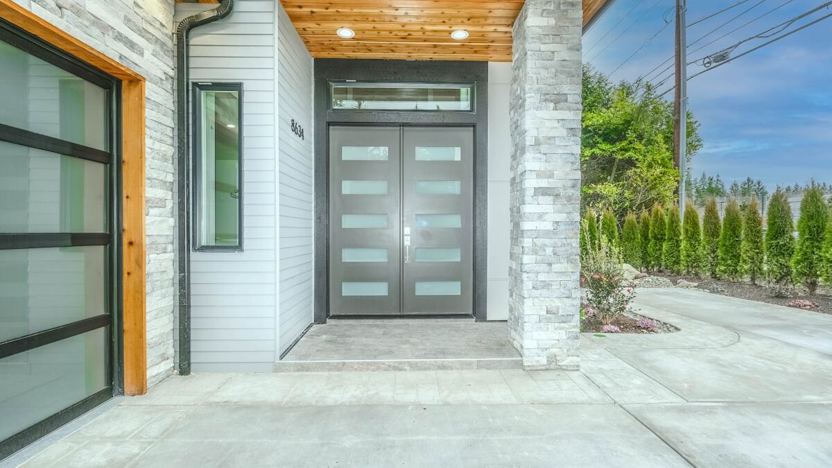 Front entrance and covered porch of a modern single-family home